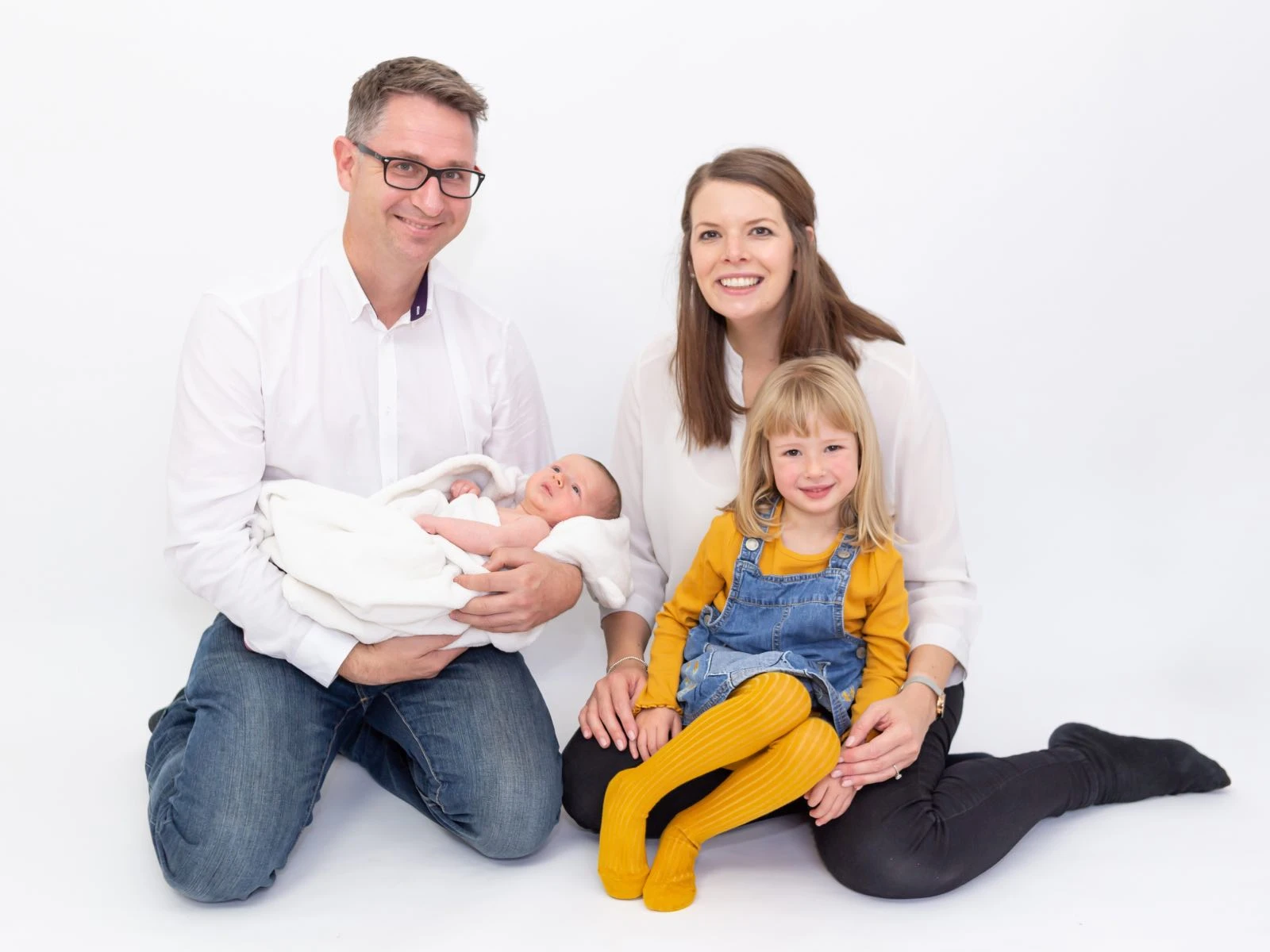 Mum, dad, daughter and baby son together