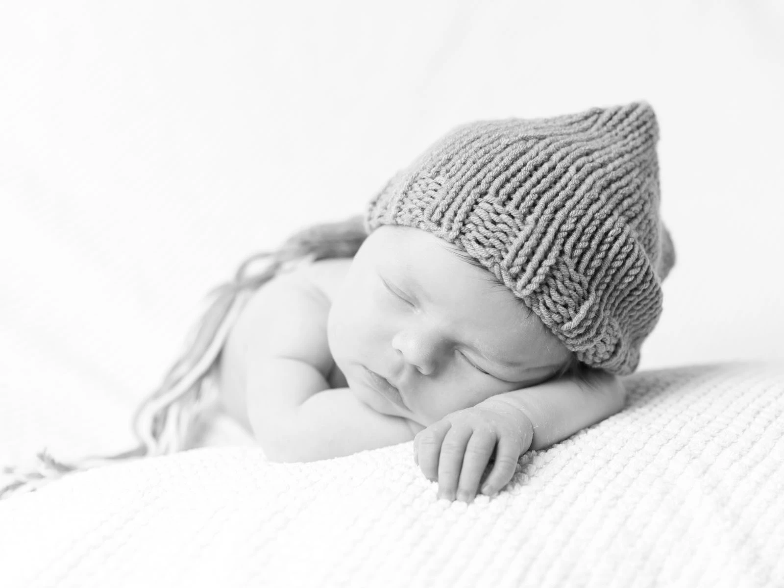 Newborn baby wearing a beanie hat