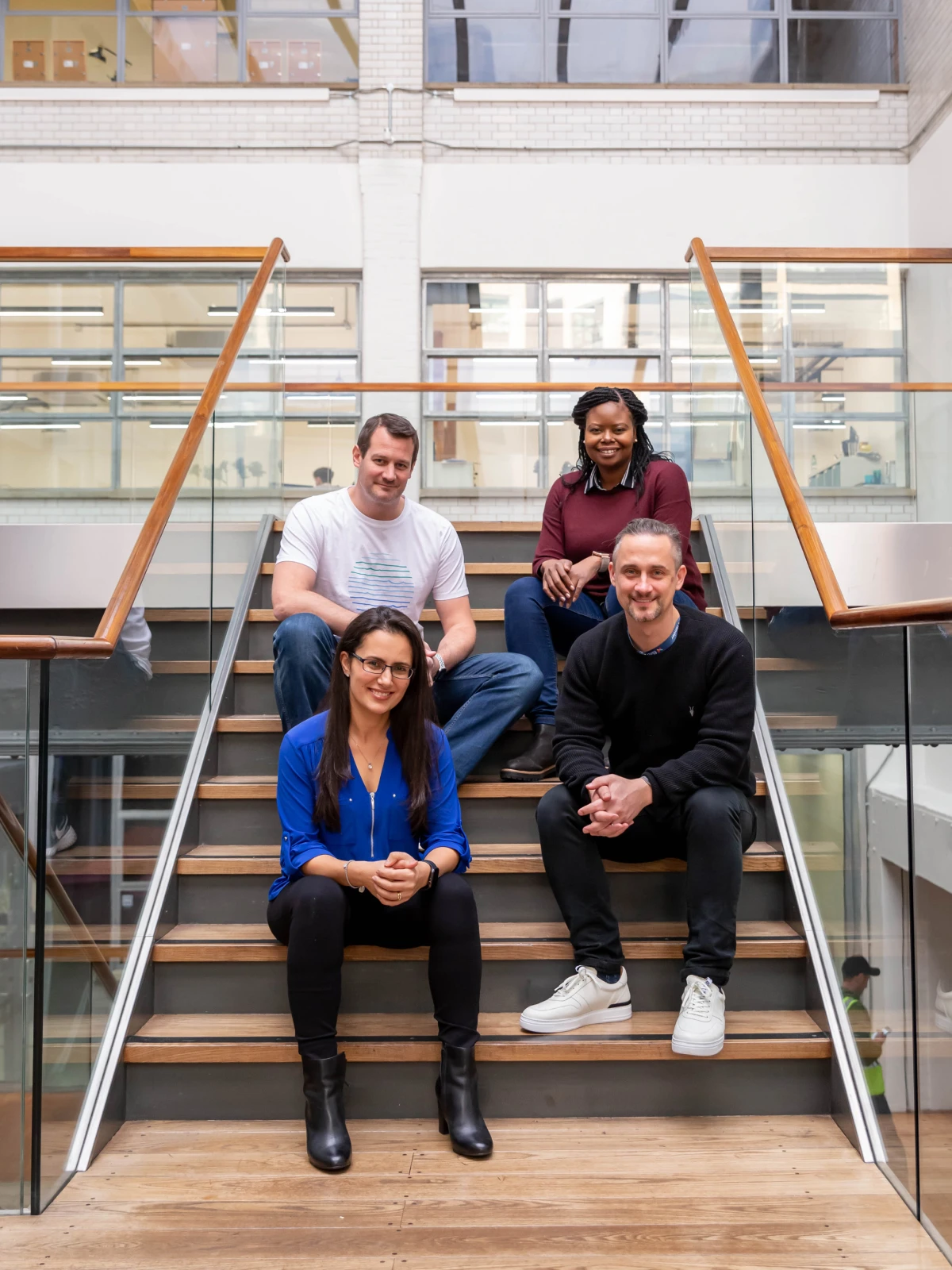 Branded photoshoot 4 CFO's sitting on steps